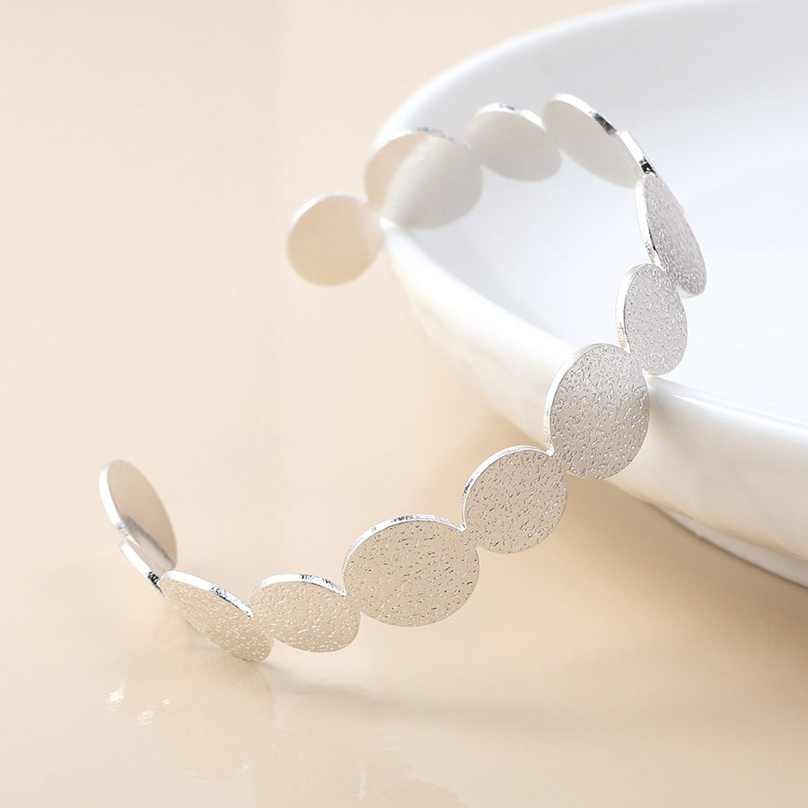 Silver plated dappled disc bangle