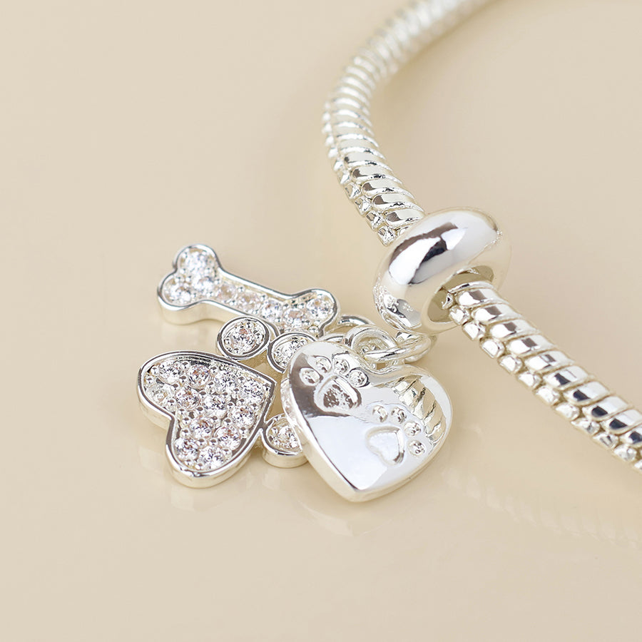 Silver plated crystal paw, bone and heart print charm bracelet