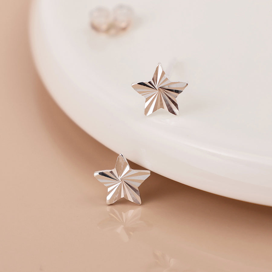 Sterling silver embossed star earrings