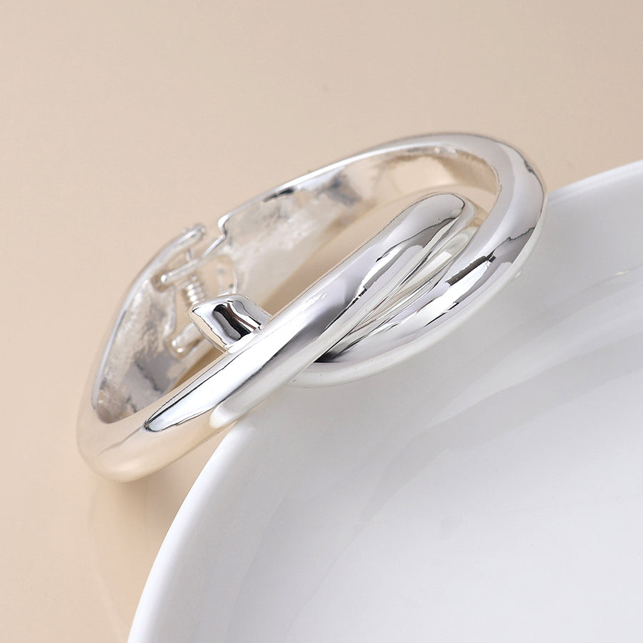 Silver plated crossover hinged bangle
