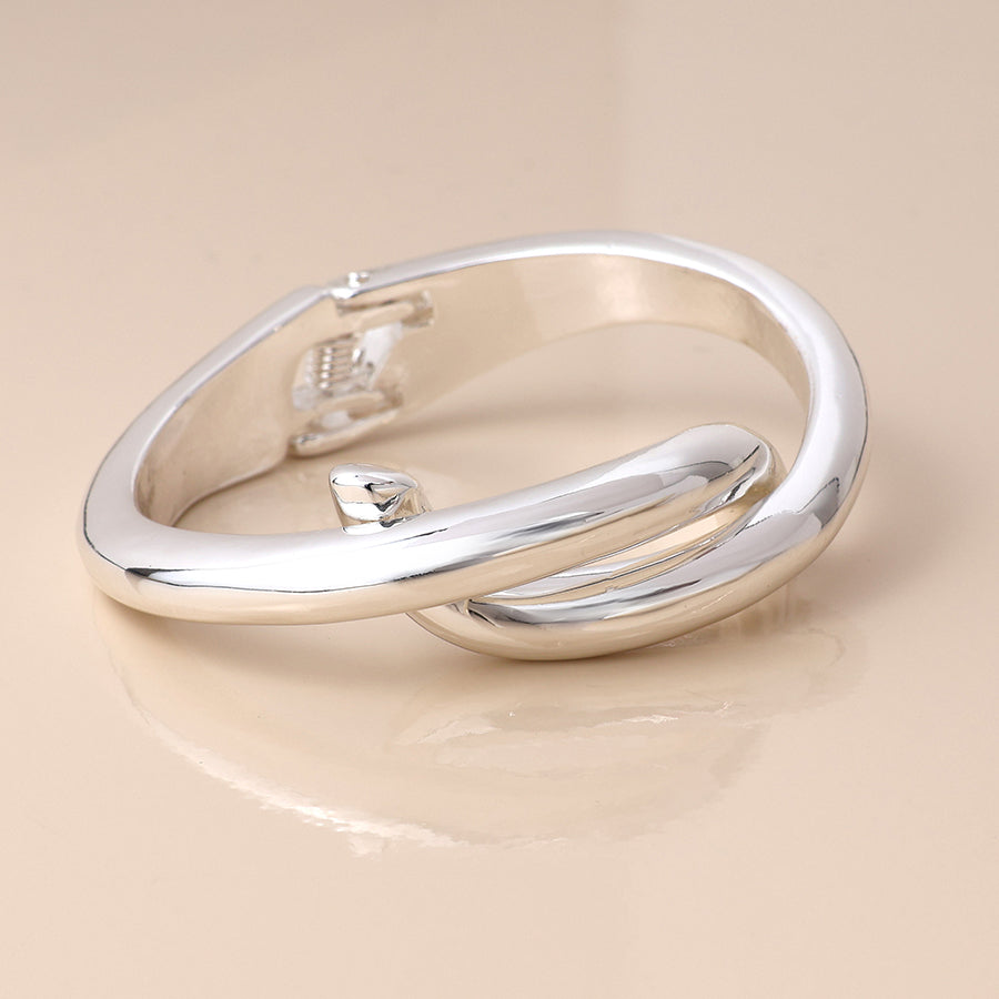 Silver plated crossover hinged bangle