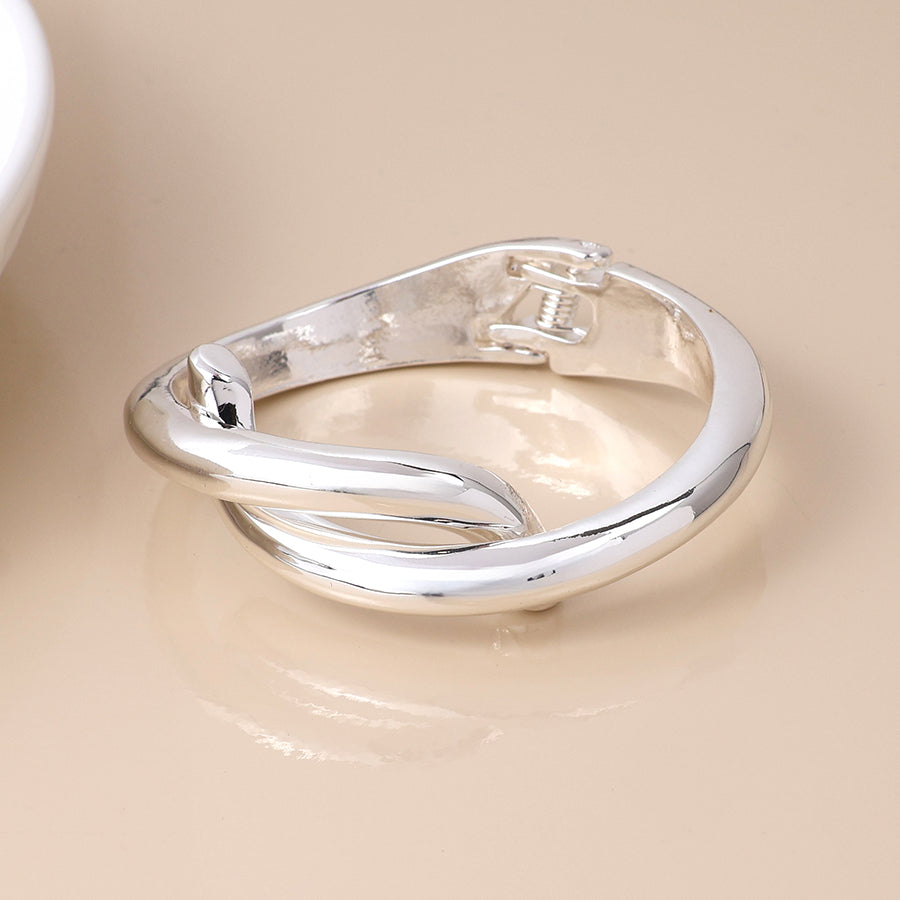 Silver plated crossover hinged bangle