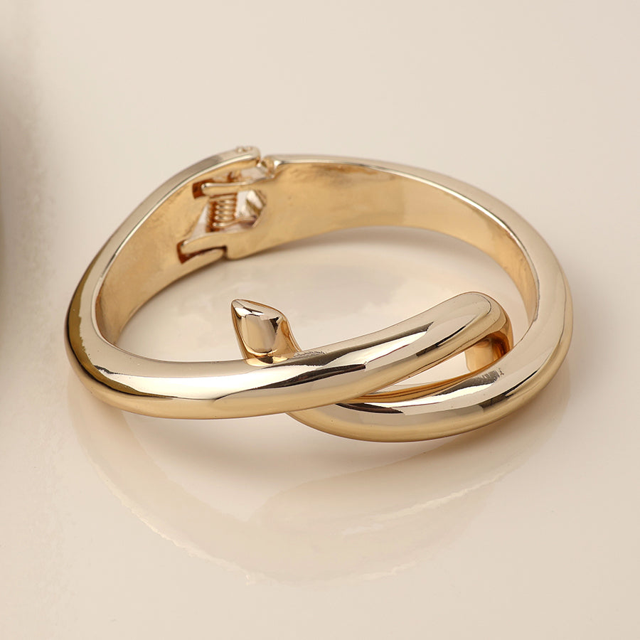 Golden crossover hinged bangle