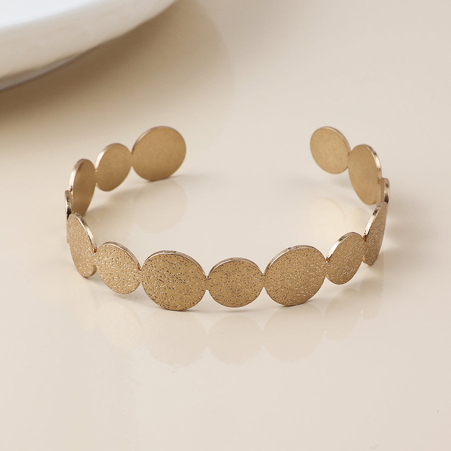 Golden dappled disc bangle