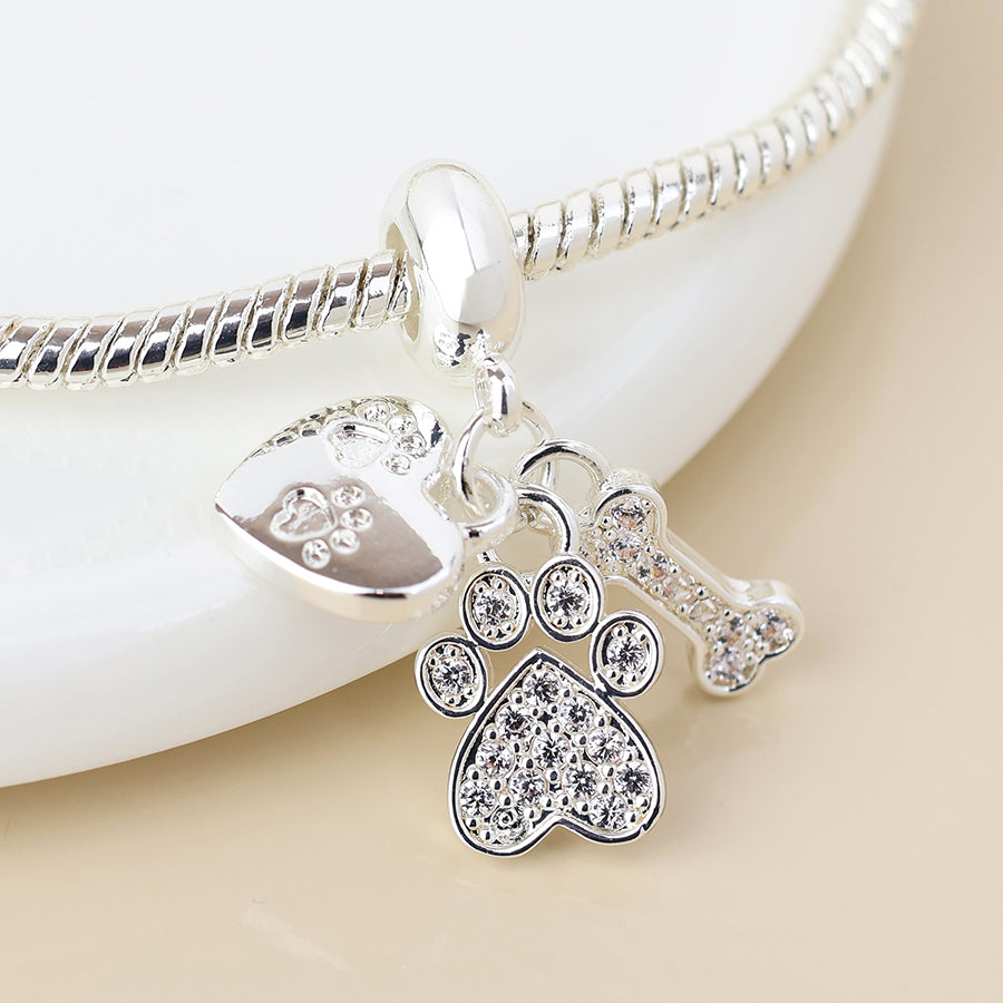Silver plated crystal paw, bone and heart print charm bracelet