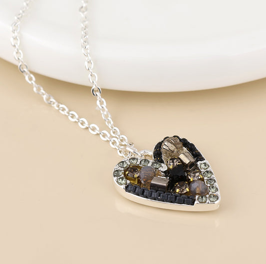 Rebel silver plated black and bronze mosaic crystal heart necklace