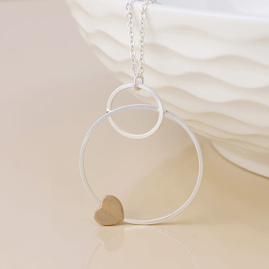 Nester silver plated worn circles and golden heart necklace