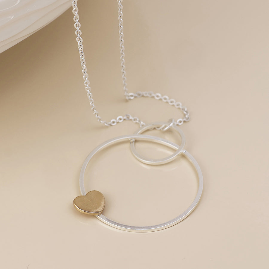 Nester silver plated worn circles and golden heart necklace