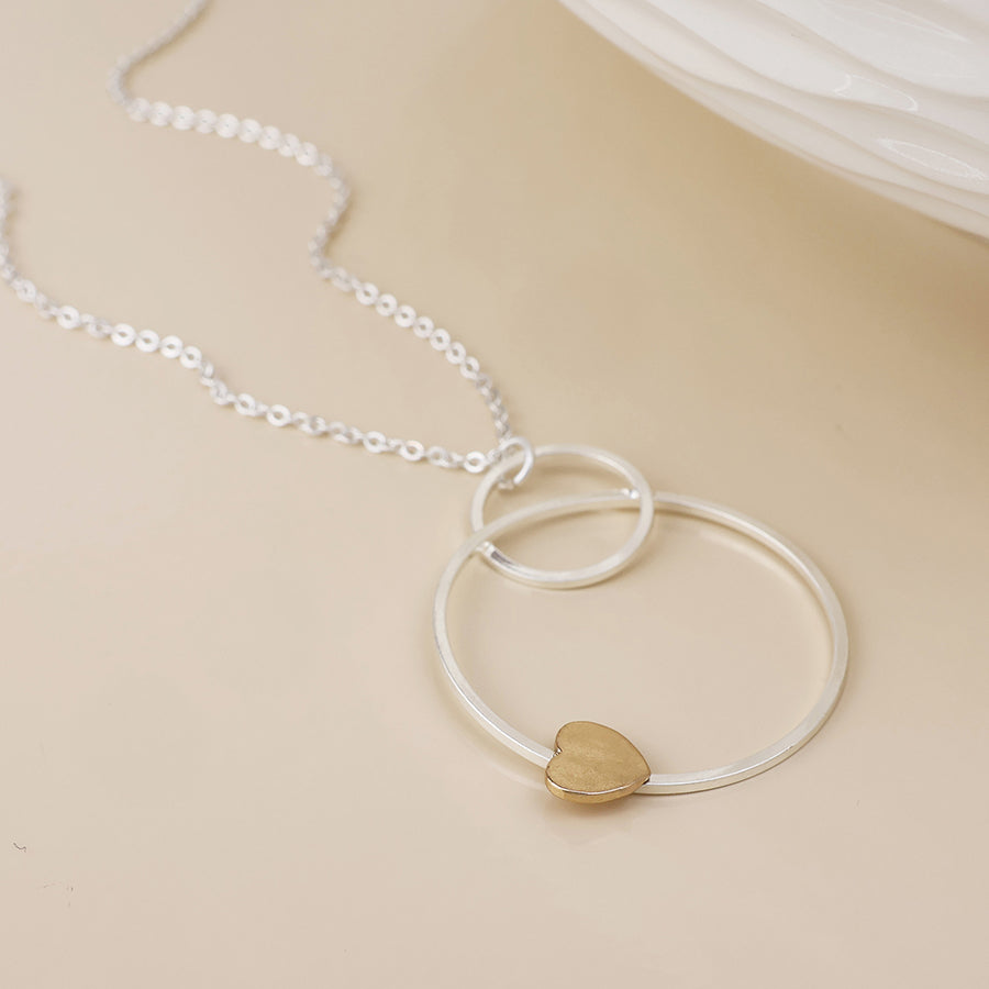 Nester silver plated worn circles and golden heart necklace