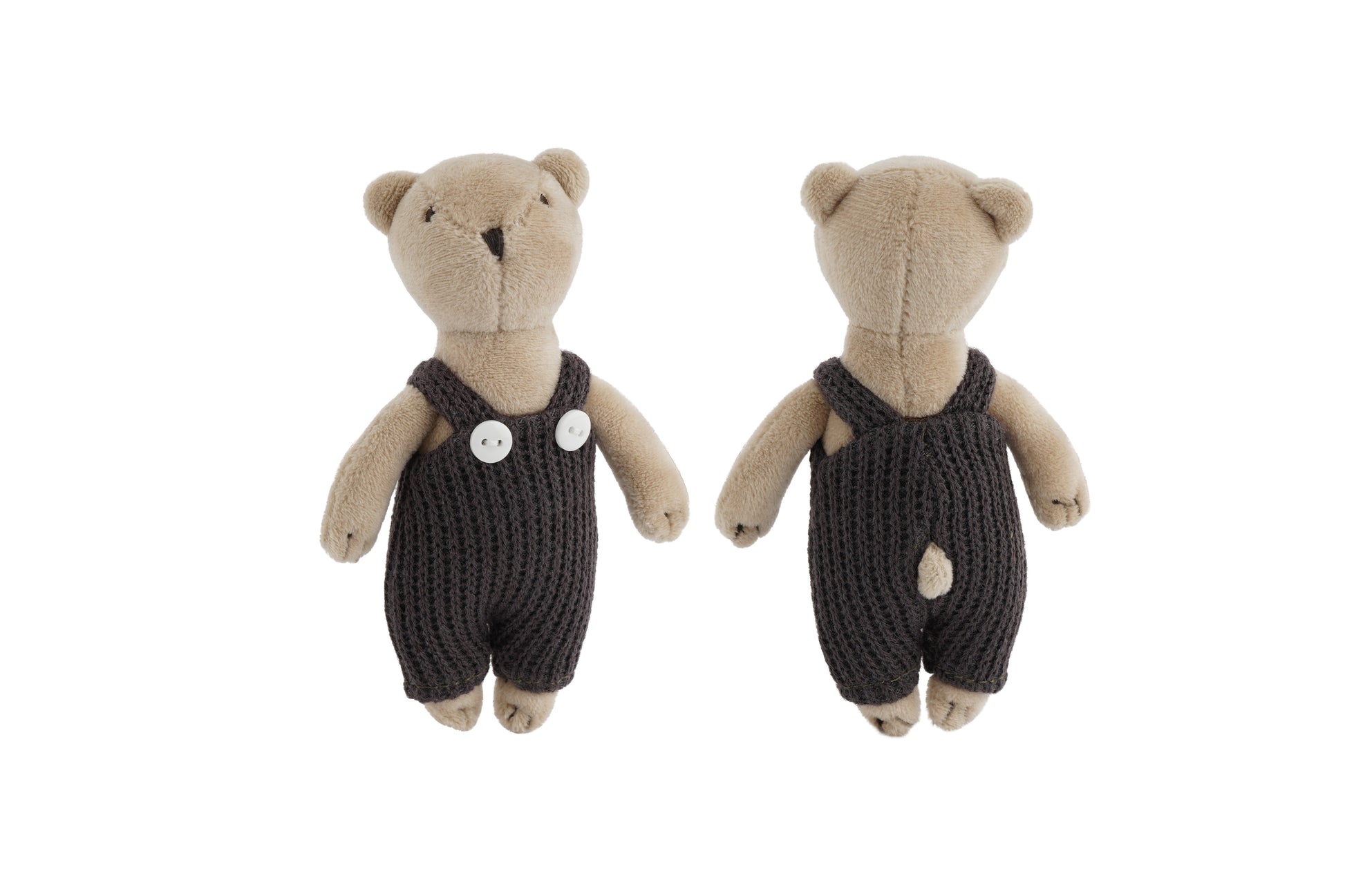 Teddy bears wearing dark knitted rompers on a white background