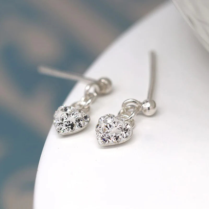 POM Sterling Silver tiny clear crystal heart drop earrings. Available at Sweet P, Burnside, Glasow