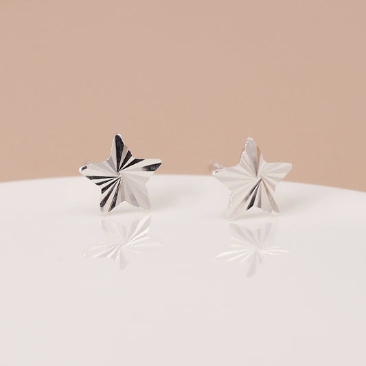 Sterling silver embossed star earrings
