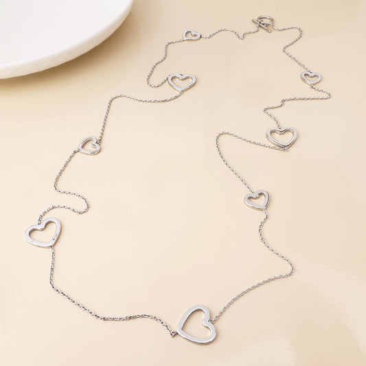 Cupid stainless steel platinum plated open hearts station necklace