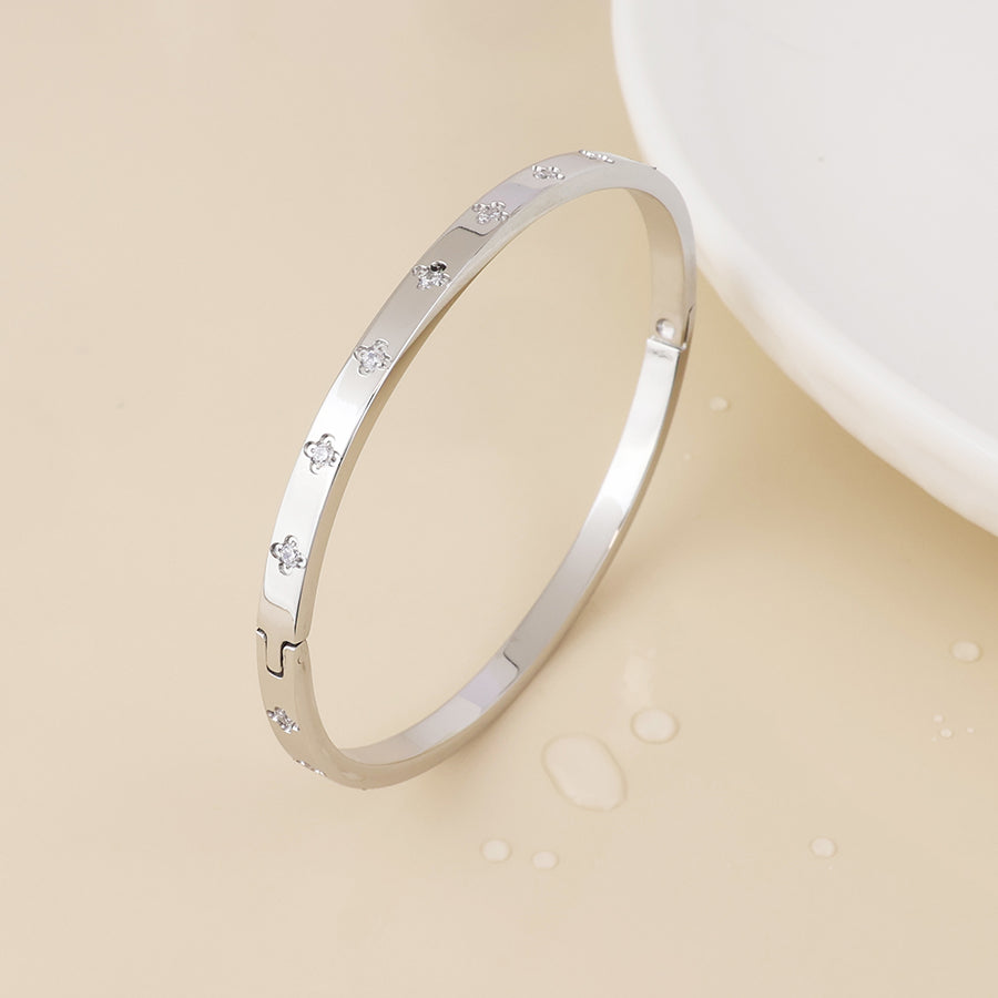 Faith stainless steel platinum plated crystal quatrefoil bangle