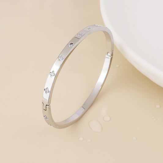 Faith stainless steel platinum plated crystal quatrefoil bangle
