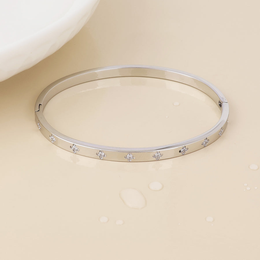 Faith stainless steel platinum plated crystal quatrefoil bangle