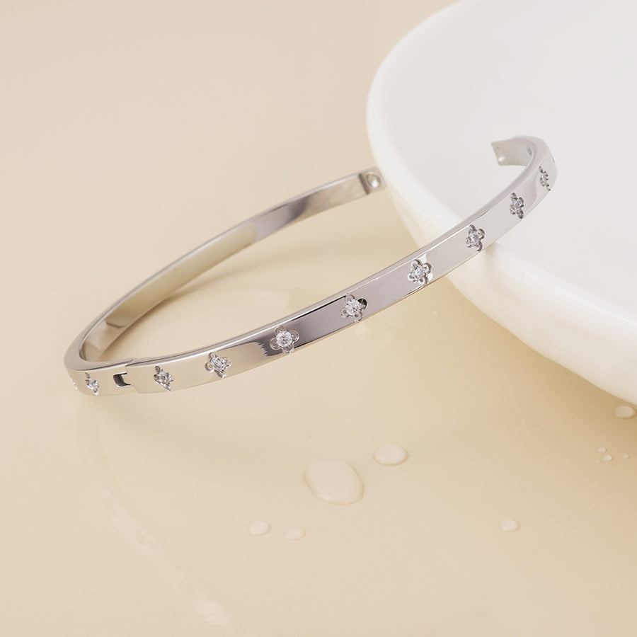 Faith stainless steel platinum plated crystal quatrefoil bangle