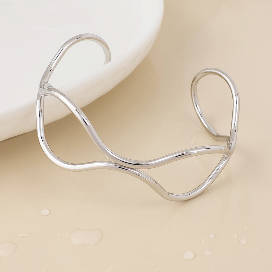 Frida stainless steel platinum plated wire wave bangle