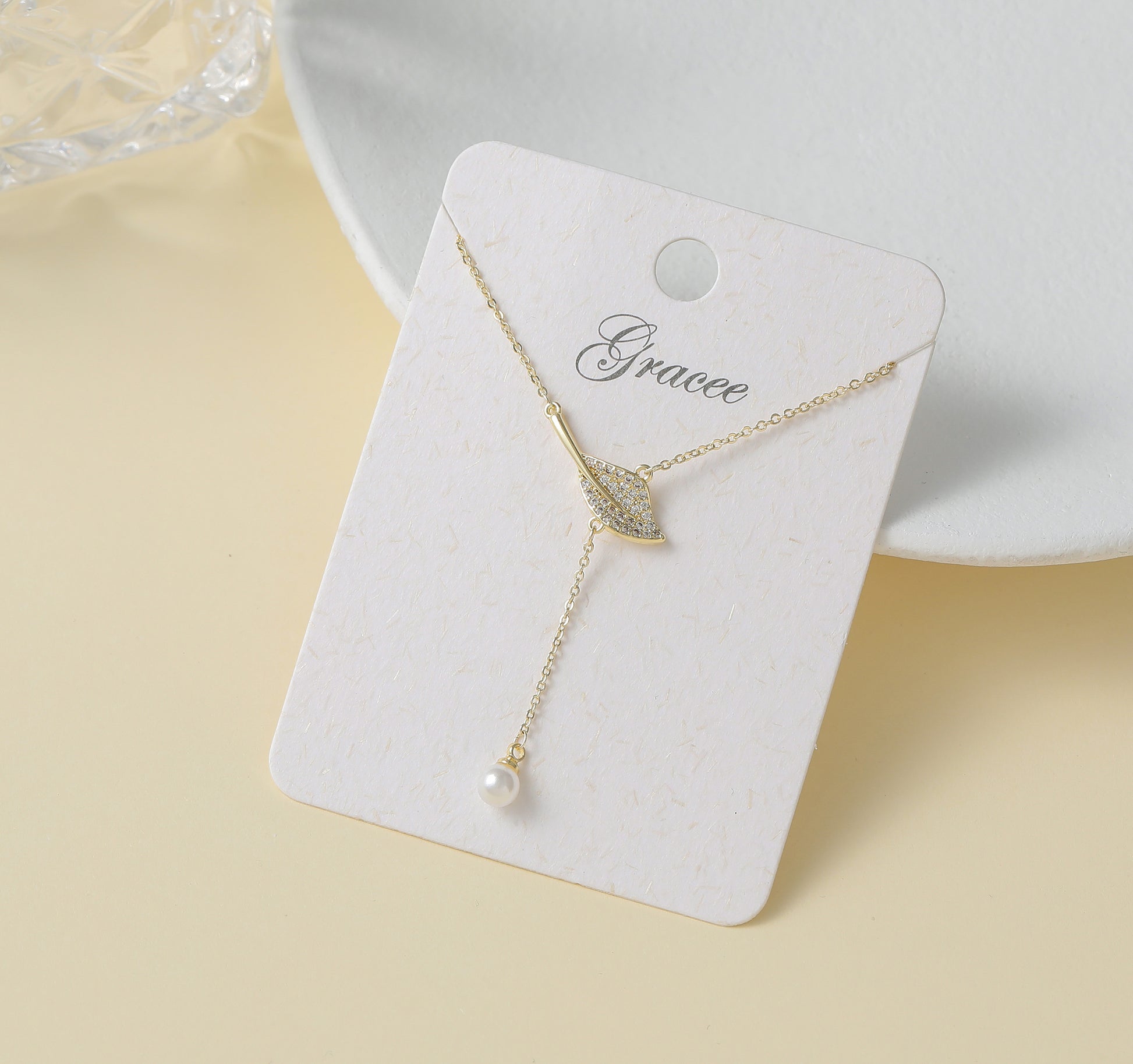 Gracee Jewellery Gold Plated Lariat Necklace with Crystal Embossed Leaf and Pearl Drop. Available at Sweet P, Burnside, Glasgow