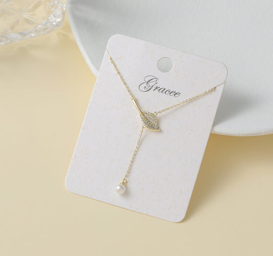 Gracee Jewellery Gold Plated Lariat Necklace with Crystal Embossed Leaf and Pearl Drop. Available at Sweet P, Burnside, Glasgow